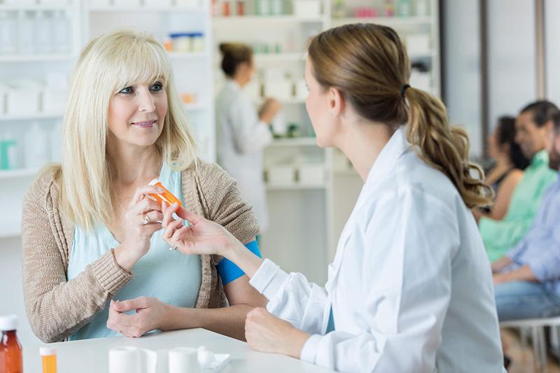 pharmacist with customer